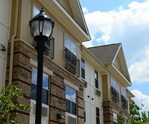 Brick and fiber cement exterior at Oasis at Scholars Landing